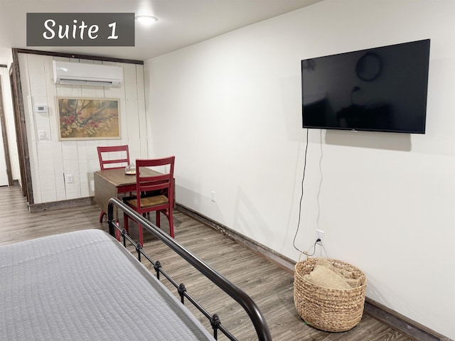 263 Jimmy Driftwood Pkwy, Mountain View, AR 72560 - bedroom featuring a wall unit AC and wood finished floors