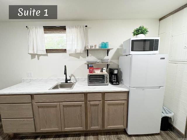 263 Jimmy Driftwood Pkwy, Mountain View, AR 72560 - kitchen with white microwave, fridge, open shelves, wood finished floors, and light stone countertops