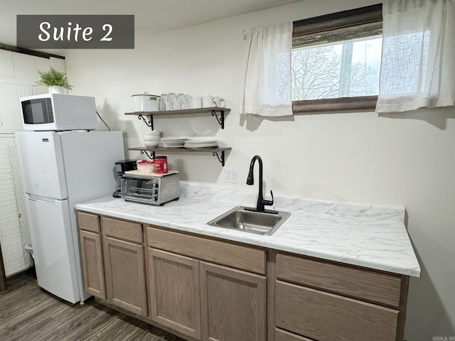 263 Jimmy Driftwood Pkwy, Mountain View, AR 72560 - kitchen featuring white appliances, dark wood-style floors, open shelves, and light countertops