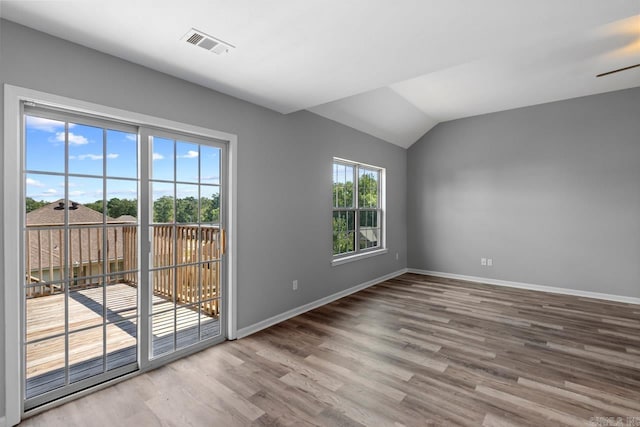 2002 Reagan Cv, Alexander, AR 72002 - spare room with wood finished floors, lofted ceiling, and a ceiling fan