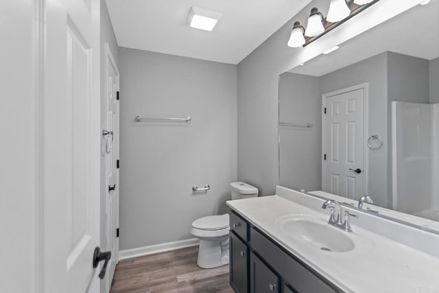 2002 Reagan Cv, Alexander, AR 72002 - bathroom featuring vanity, wood finished floors, and a shower