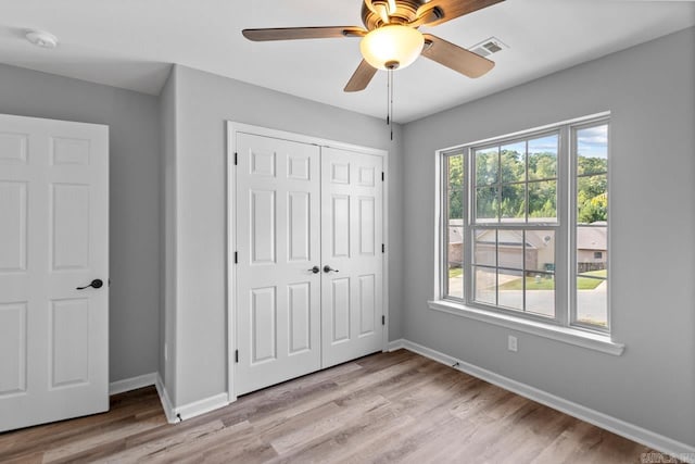 2002 Reagan Cv, Alexander, AR 72002 - unfurnished bedroom featuring a closet, light wood-style floors, and ceiling fan