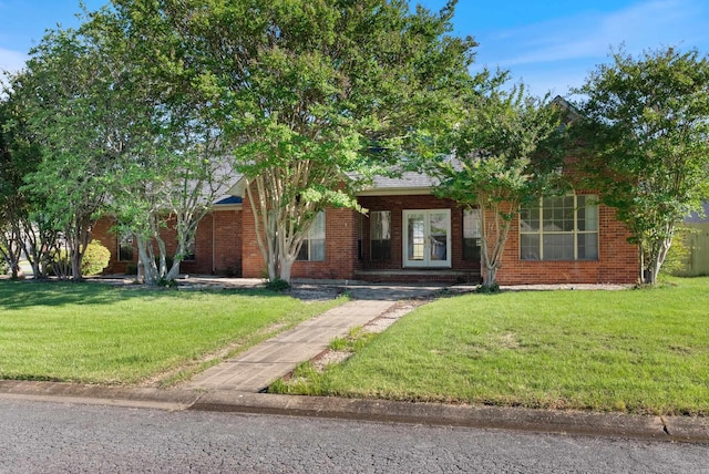 930 Enderlin, Conway, AR 72034 - obstructed view of property featuring a front yard and brick siding