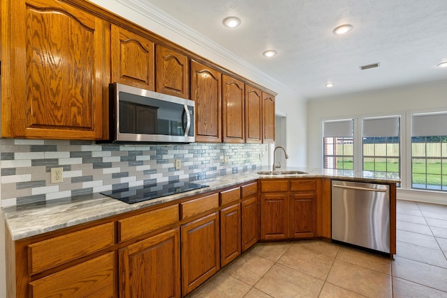930 Enderlin, Conway, AR 72034 - kitchen with stainless steel appliances, backsplash, light stone countertops, light tile patterned floors, and ornamental molding