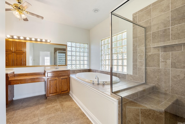 930 Enderlin, Conway, AR 72034 - full bathroom with vanity, healthy amount of natural light, a bath, and a ceiling fan