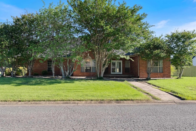 930 Enderlin, Conway, AR 72034 - obstructed view of property with french doors, a front lawn, and brick siding