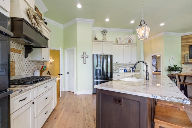13518 Pikes Peak Pl, Rogers, AR 72756 - kitchen with stainless steel fridge with ice dispenser, gas cooktop, decorative backsplash, recessed lighting, and crown molding