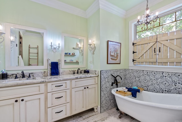 13518 Pikes Peak Pl, Rogers, AR 72756 - full bath with tile walls, a freestanding bath, double vanity, a chandelier, and crown molding