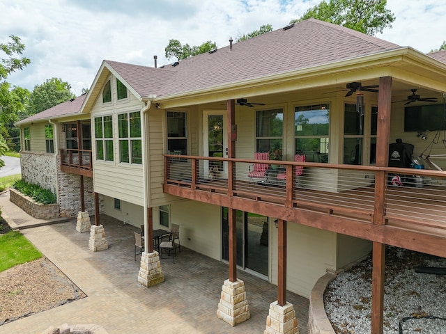 13518 Pikes Peak Pl, Rogers, AR 72756 - back of property with a ceiling fan, a patio, roof with shingles, and a sunroom