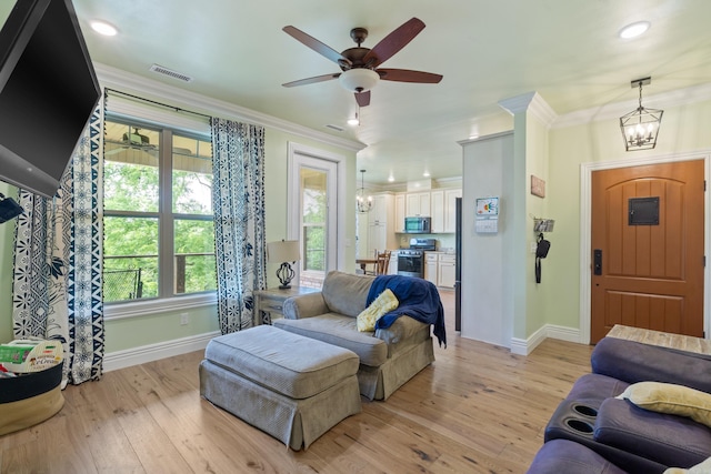 13518 Pikes Peak Pl, Rogers, AR 72756 - living room featuring ornamental molding, a chandelier, light wood-style floors, ceiling fan, and recessed lighting