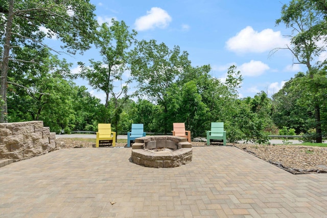 13518 Pikes Peak Pl, Rogers, AR 72756 - view of patio featuring an outdoor fire pit