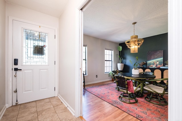 entrance foyer featuring a chandelier and a textured ceiling