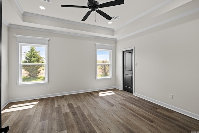 7213 Stonehenge Dr, Sherwood, AR 72120 - empty room with a raised ceiling, ornamental molding, dark wood-type flooring, a ceiling fan, and recessed lighting