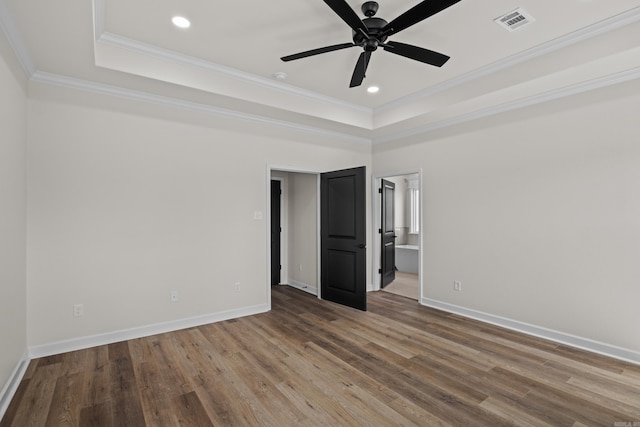 7213 Stonehenge Dr, Sherwood, AR 72120 - spare room featuring a tray ceiling, ceiling fan, wood finished floors, crown molding, and recessed lighting
