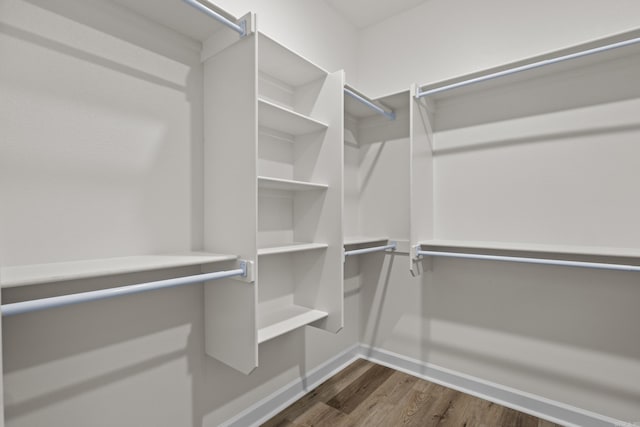 7213 Stonehenge Dr, Sherwood, AR 72120 - spacious closet with dark wood-style floors