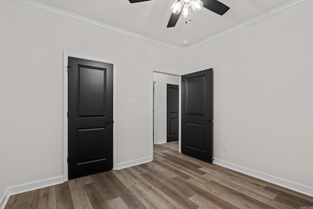 7213 Stonehenge Dr, Sherwood, AR 72120 - unfurnished bedroom with crown molding, wood finished floors, and a ceiling fan