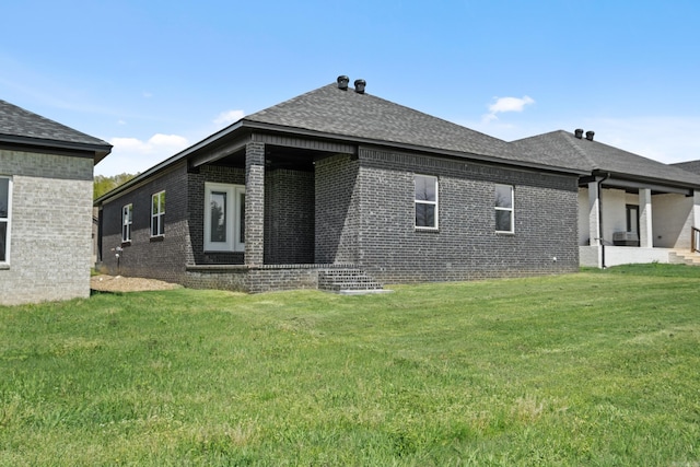 7213 Stonehenge Dr, Sherwood, AR 72120 - rear view of house featuring brick siding, a yard, and a shingled roof