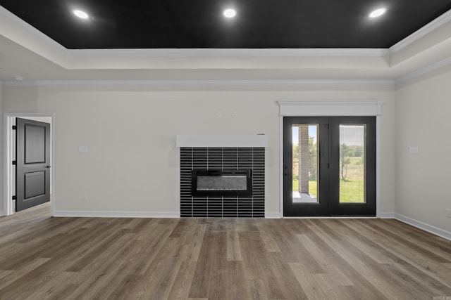 7213 Stonehenge Dr, Sherwood, AR 72120 - unfurnished living room featuring a tray ceiling, crown molding, wood finished floors, a fireplace, and recessed lighting