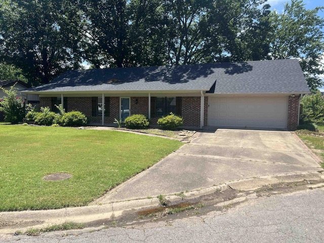 11 Laura Ln, Conway, AR 72034 - view of front of home with a garage, a front yard, brick siding, and driveway