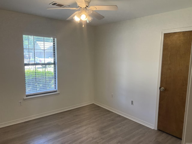 11 Laura Ln, Conway, AR 72034 - unfurnished room featuring dark wood-style floors, healthy amount of natural light, and ceiling fan