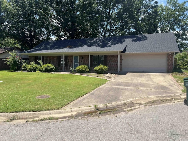 11 Laura Ln, Conway, AR 72034 - view of front facade featuring an attached garage, a front yard, and brick siding
