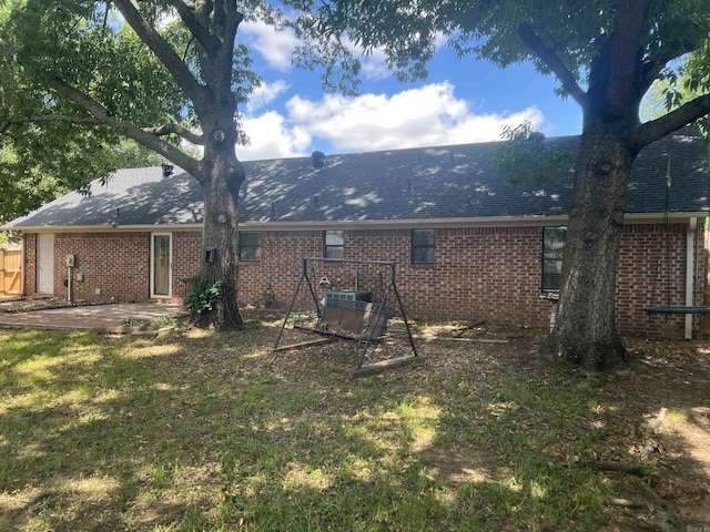 11 Laura Ln, Conway, AR 72034 - rear view of house with a patio, brick siding, and a shingled roof