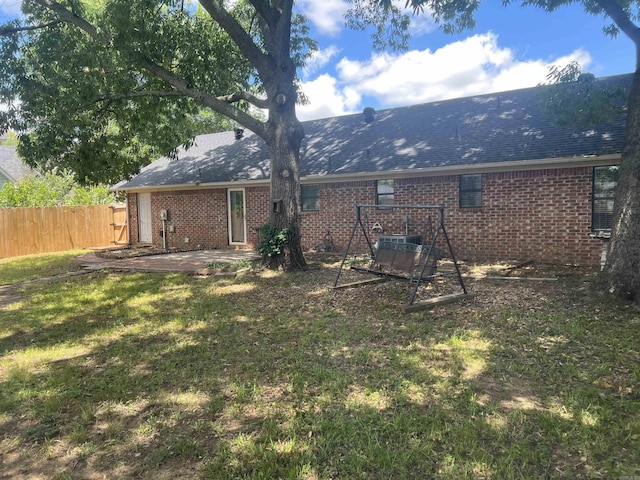 11 Laura Ln, Conway, AR 72034 - rear view of house with a patio area, brick siding, and roof with shingles