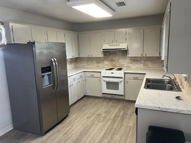 11 Laura Ln, Conway, AR 72034 - kitchen with stainless steel fridge, electric range, extractor fan, light wood finished floors, and light countertops