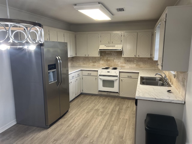 11 Laura Ln, Conway, AR 72034 - kitchen with white range with electric stovetop, stainless steel fridge with ice dispenser, under cabinet range hood, light wood-style flooring, and crown molding