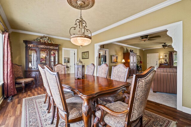 410 E Green St, Morrilton, AR 72110 - dining room featuring dark wood-type flooring, ceiling fan, and crown molding