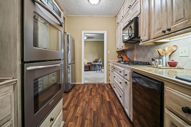 410 E Green St, Morrilton, AR 72110 - kitchen with black appliances, tasteful backsplash, light countertops, a textured ceiling, and dark wood-style flooring