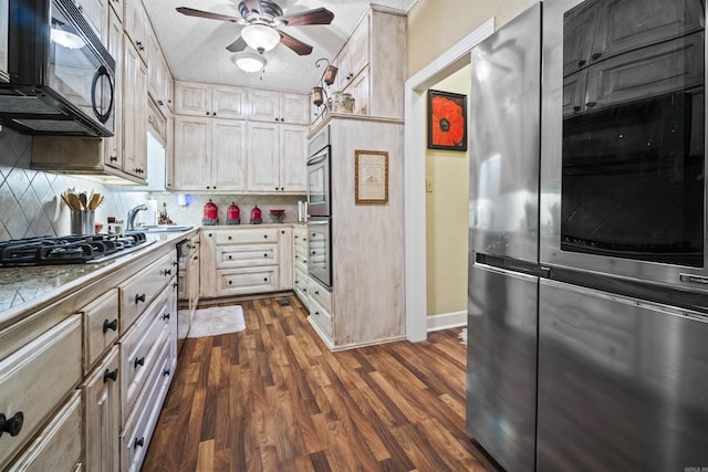 410 E Green St, Morrilton, AR 72110 - kitchen featuring black microwave, smart refrigerator, gas cooktop, ceiling fan, and decorative backsplash
