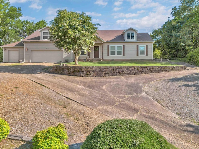 410 E Green St, Morrilton, AR 72110 - view of front of home featuring driveway and a garage