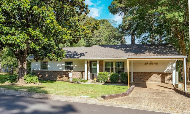 4203 Glenda Ln, Benton, AR 72019 - ranch-style home with brick siding, a front lawn, an attached carport, and concrete driveway