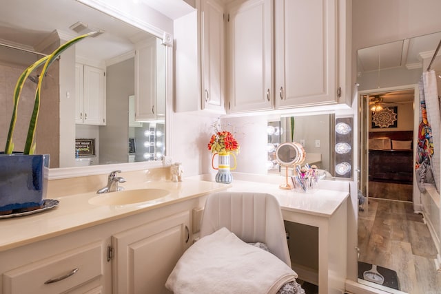 4203 Glenda Ln, Benton, AR 72019 - bathroom with wood finished floors, vanity, and ornamental molding