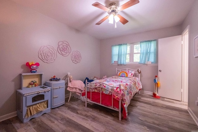 4203 Glenda Ln, Benton, AR 72019 - bedroom with wood finished floors and a ceiling fan