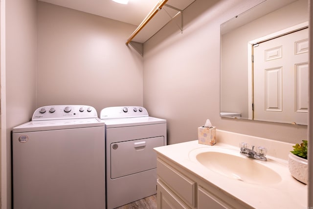 4203 Glenda Ln, Benton, AR 72019 - laundry area featuring washing machine and clothes dryer and light wood-style floors