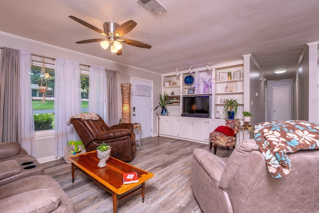 4203 Glenda Ln, Benton, AR 72019 - living room with wood finished floors, ceiling fan, and crown molding