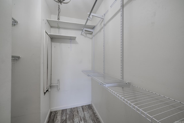 1005 S German Ln, Conway, AR 72034 - walk in closet featuring wood finished floors