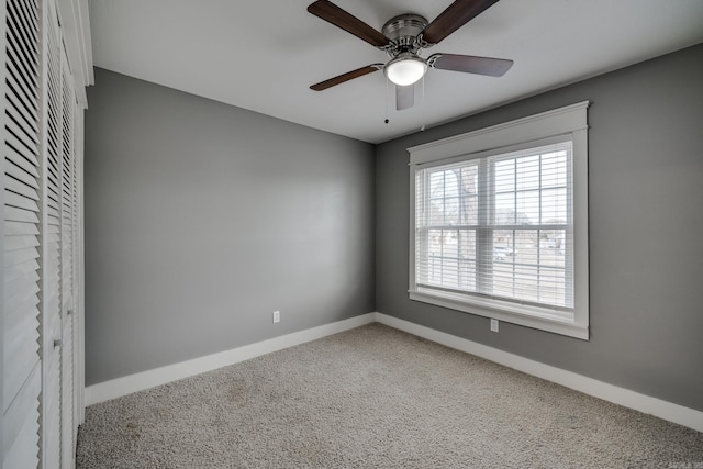 1005 S German Ln, Conway, AR 72034 - carpeted empty room with baseboards and ceiling fan