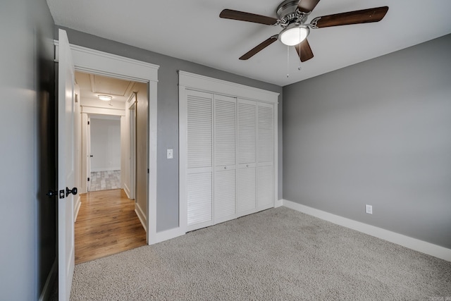 1005 S German Ln, Conway, AR 72034 - unfurnished bedroom featuring attic access, carpet, a closet, and a ceiling fan