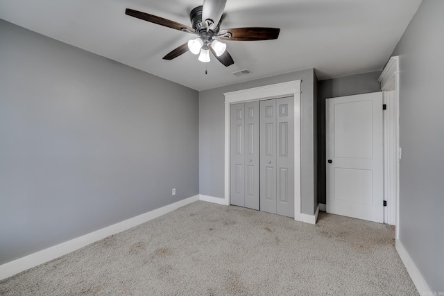 1005 S German Ln, Conway, AR 72034 - unfurnished bedroom featuring carpet flooring, a closet, and a ceiling fan