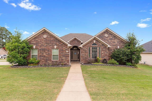 2104 Magna Carta Ln, Bryant, AR 72022 - view of front of home featuring a front lawn and brick siding