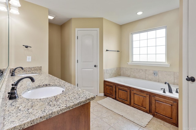 2104 Magna Carta Ln, Bryant, AR 72022 - full bathroom featuring double vanity, tile patterned floors, and a garden tub
