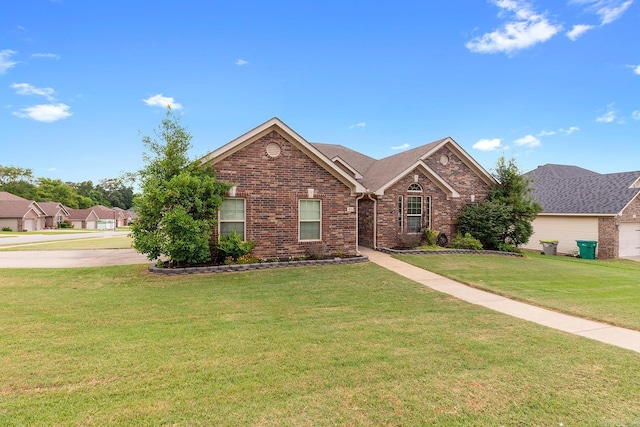 2104 Magna Carta Ln, Bryant, AR 72022 - view of front of house with a front lawn and brick siding