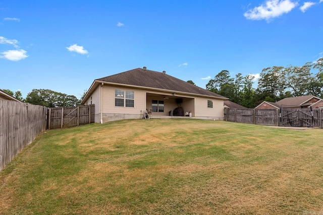 2104 Magna Carta Ln, Bryant, AR 72022 - rear view of house featuring a fenced backyard, a patio, and a gate