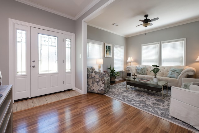 2222 N University, Little Rock, AR 72207 - entryway featuring wood finished floors, a ceiling fan, and ornamental molding