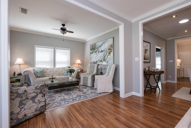2222 N University, Little Rock, AR 72207 - living area featuring wood finished floors, healthy amount of natural light, a ceiling fan, crown molding, and recessed lighting
