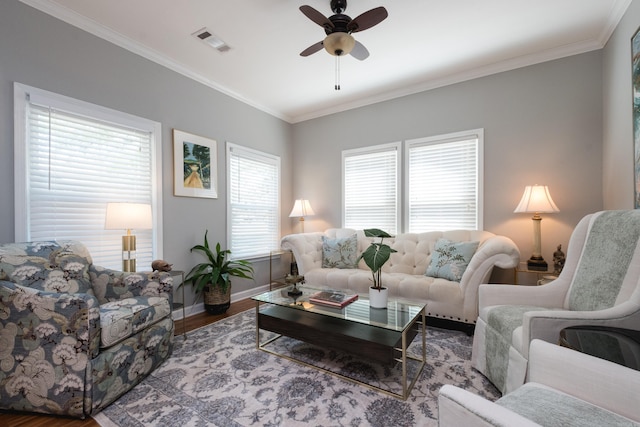 2222 N University, Little Rock, AR 72207 - living area with wood finished floors, ceiling fan, and crown molding