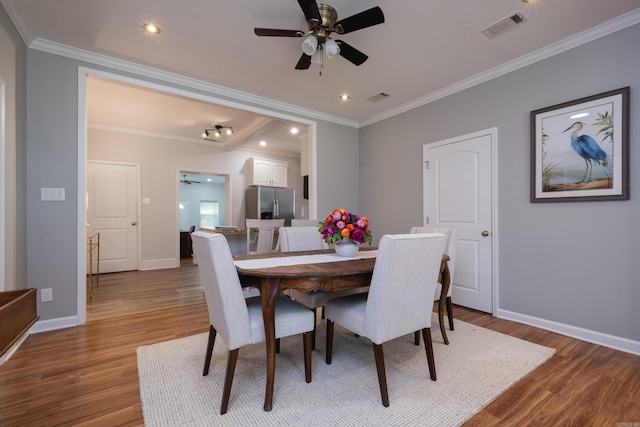 2222 N University, Little Rock, AR 72207 - dining space featuring ceiling fan, wood finished floors, crown molding, and recessed lighting